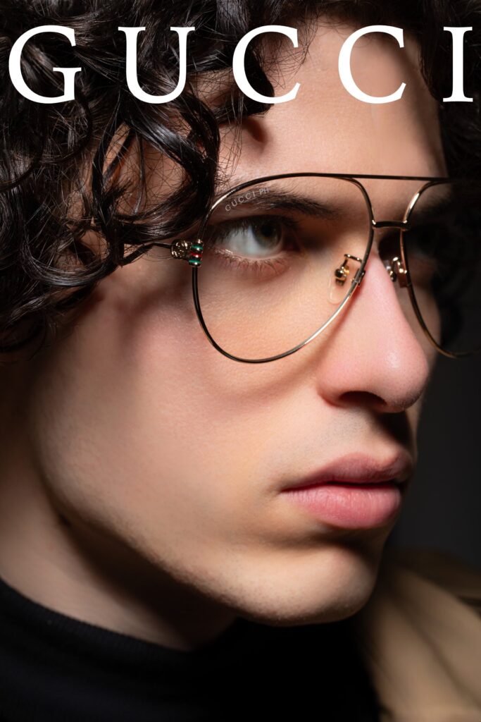 Portrait masculin avec lunettes de soleil, style éditorial mode, lumière contrastée